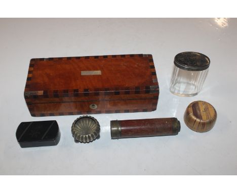 A wooden inlaid box and contents to include brass telescope, silver plated salt, snuff box, silver topped dressing table jar 