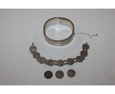 A silver coin bracelet and a silver snap bangle 