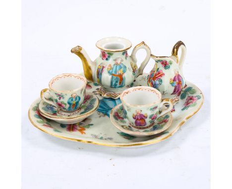 A Chinese famille rose porcelain doll's tea service on matching tray, tray length 14cm 