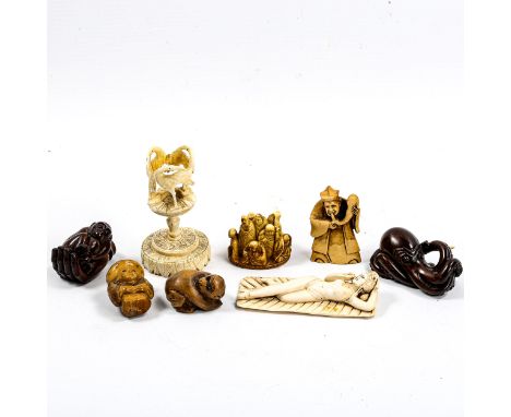 A group of Oriental ivory and wood netsuke, and an ivory stork design stand (8) 
