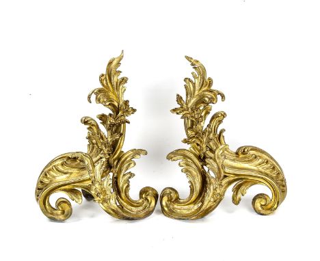 A pair of gilt-bronze Rococo style chenet fire dogs, height 38cm 