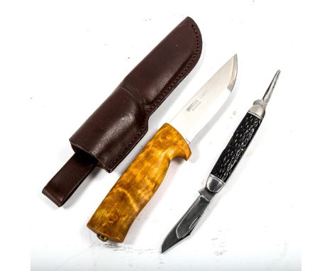 A multi-bladed American knife, by Craftsman USA, and a Norwegian forest worker's knife, by Helle, with leather scabbard, leng