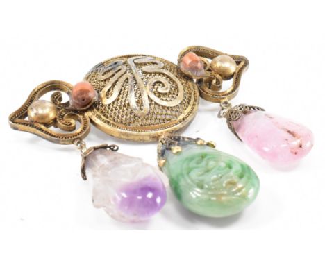 An antique early 20th Century Chinese jade, amethyst and rose quartz brooch. The brooch having yellow metal wire work body wi