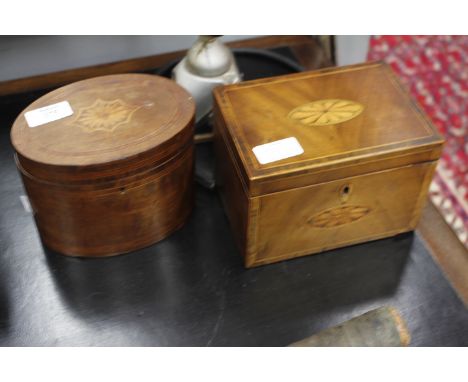 AN ANTIQUE MAHOGANY TEA CADDY with decorative inlay and rosewood cross banding, 17.7cm wide together with an antique mahogany