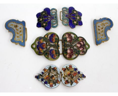 FOUR ART NOUVEAU GILT METAL AND ENAMELLED BELT BUCKLES  
