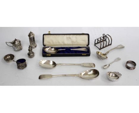 A SELECTION OF SILVER PIERCED TABLE CONDIMENTS tea strainer, ladle, spoons, toast rack, salad servers etc., 