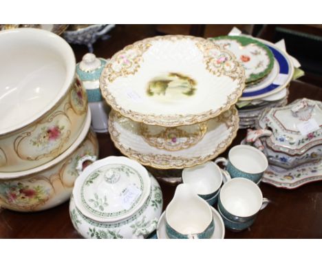 A PAIR OF VICTORIAN STAFFORDSHIRE PORCELAIN COMPORTS decorated with flowers within a gilt and basket weave moulded border, ce