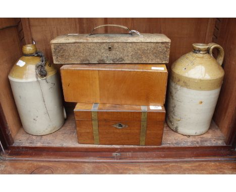 A COLEMAN SPIRIT MERCHANT BICESTER STONEWARE FLAGON, a similar stoneware jar, a Victorian mahogany writing slope, a leather j