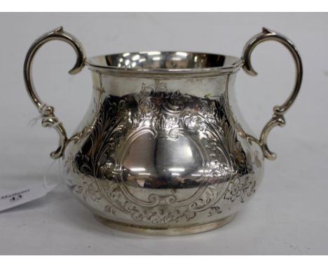 A VICTORIAN LONDON SILVER TWO HANDLED SUGAR BASIN with foliate engraved decoration and blank cartouche, marked 2893 to the ba
