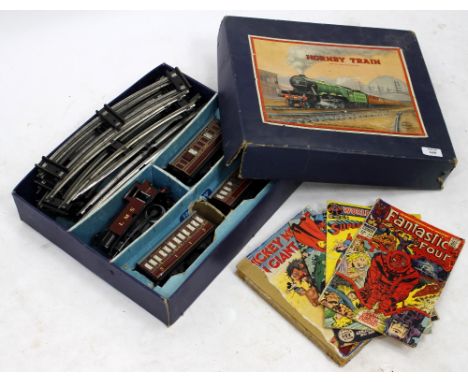 A MECCANO HORNBY BOXED TRAIN SET with engine carriages, track etc., and a selection of accessories, Rupert annuals, Mickey Mo