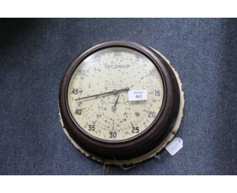 AN OLD BAKELITE CASED WALL MOUNTED TIMER by Smith's English Clocks Limited, 32cm diameter
