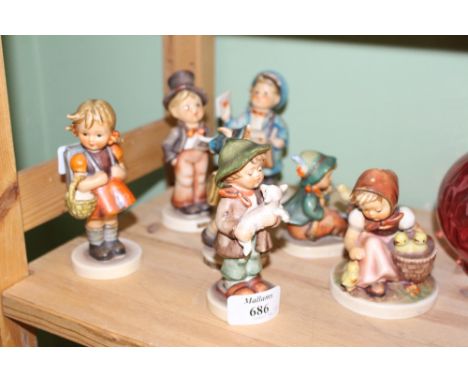 A COLLECTION OF SEVEN GOEBEL FIGURES of children (7)