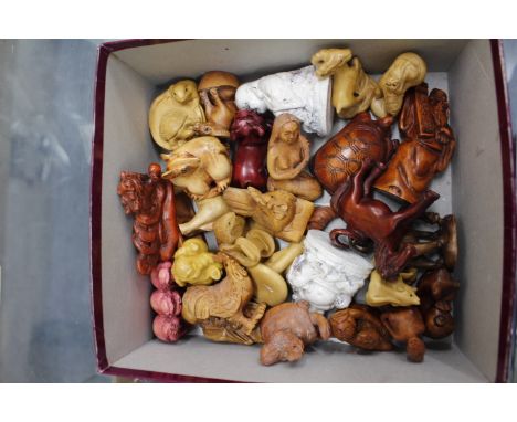 A COLLECTION OF LATE 20TH CENTURY EASTERN CARVED WOODEN AND RESIN NETSUKE 