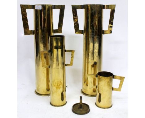 FOUR WORLD WAR ONE TRENCH ART SHELL CASES, the larger two inscribed 'The Balkans, Serbian Front', each with applied handles, 
