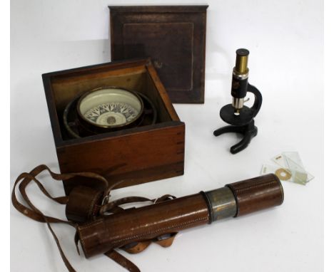 A LEATHER CASED BRASS THREE DRAWER 'FIELD' TELESCOPE by Aitchison of London, numbered 5384, 81cm long extended together with 