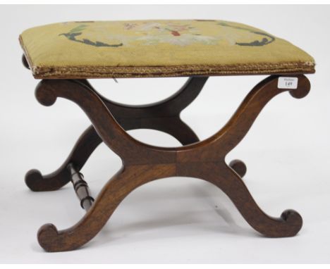 A WILLIAM IV ROSEWOOD X-FRAMED STOOL with a tapestry top, 50cm x 36cm x 43cm