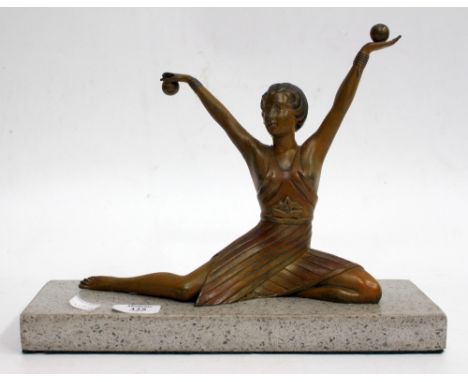AN ART DECO STYLE SPELTER FIGURE OF A DANCING LADY on a hardstone base, 33cm wide 