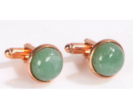 Pair of Jade and yellow metal cuff-links, set with a cabochon cut jade stone&nbsp;