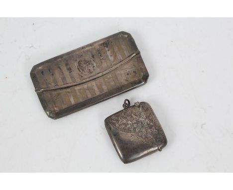 George V silver visiting card case, Chester 1914, with engine turned case, together with a silver vesta case, Birmingham 1915