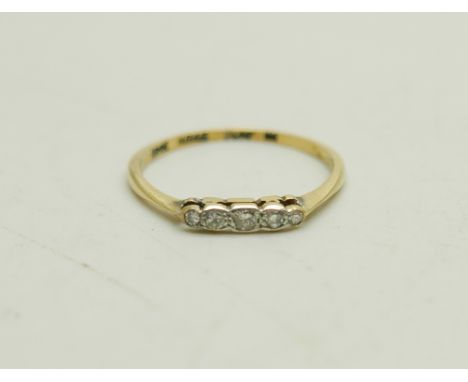 An 18ct gold and platinum ring set with five small diamonds, 1.4g, O 
