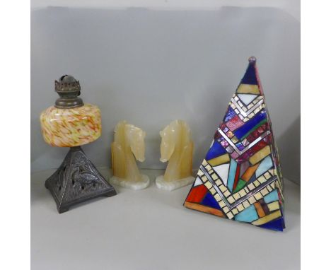 A decorative mosaic glass pyramid, glass jam jar, EP lid with spoon, an oil lamp, a/f and a pair of onyx horse head bookends,