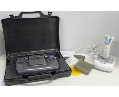 Vintage Sega game gear console with carry case and Super Nintendo joystick 