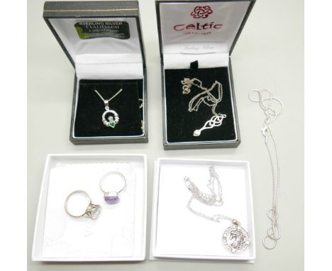 Silver jewellery including a ring and three pendants with chains, together with a platinum ring set with a white stone, 4.6g,