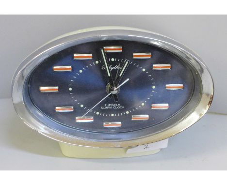 A 1960s Rhythm mechanical alarm clock, two jewels movement 
