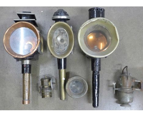 Three 19th Century carriage lamps, a motorcycle lamp and one other a/f 