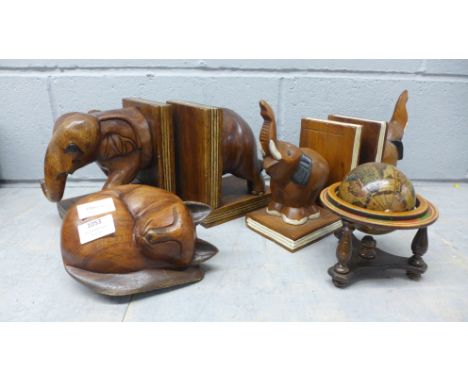 Two pairs of carved bookends in the form of elephants, a wooden globe, and a carved wooden cat **PLEASE NOTE THIS LOT IS NOT 