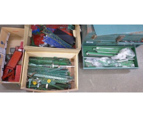 A metal tool cabinet containing Meccano parts and three boxes of loose Meccano 