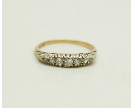 An 18ct gold ring set with seven diamonds, 2.7g, O/P 
