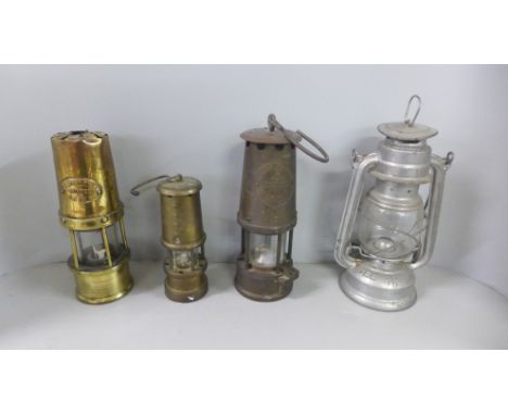 An Eccles miner's lamp, W.E Teale Swinton Lancs lamp, miniature lamp and one other 