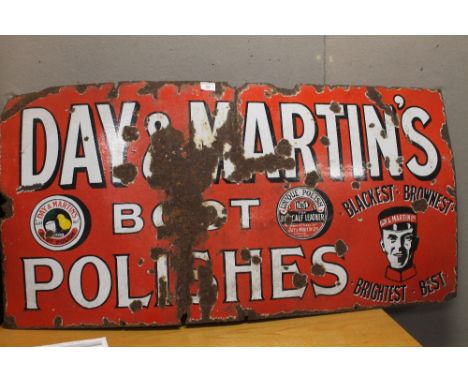 AN ANTIQUE ENAMEL SIGN ADVERTISING 'DAY AND MARTINS BOOT POLISH', white on red pictorial type. 61cm by 122cm 