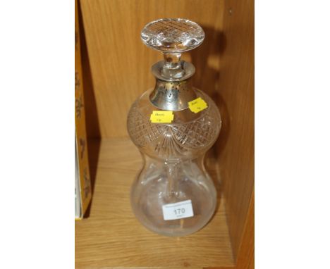 A HALLMARKED SILVER AND CUT GLASS GLUG GLUG DECANTER 