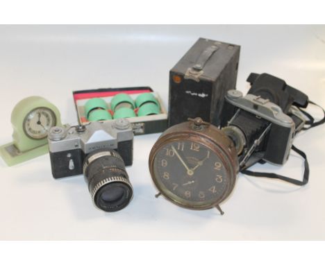 A BOX OF COLLECTABLES TO INCLUDE AN INGERSOLL WIND UP CLOCK, A ZENIT -B CAMERA, KERSHAW 110 CAMERA, ETC 