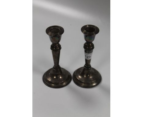 A PAIR OF HALLMARKED SILVER CANDLE STICK HOLDERS 