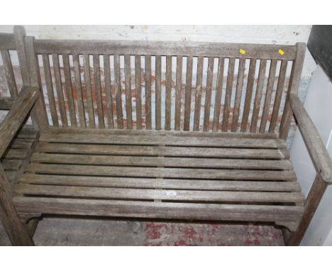 A WOODEN GARDEN BENCH