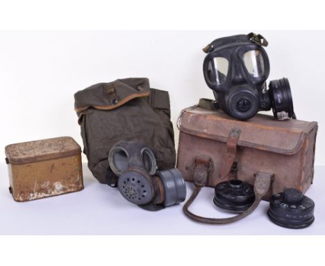 Two Modern British Army Gas Masks, one complete with the original carry pouch; WW2 Period tin gas mask container (no gas mask