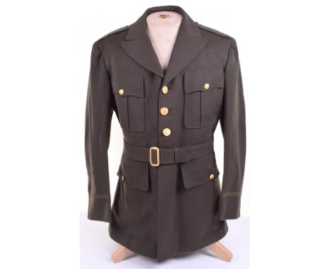 Un-issued US Army Four Pocket Officers Tunic, M-44 pattern tunic with gilt metal eagle buttons. Complete with the belt. Lower