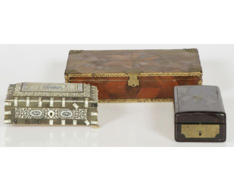 Amongst which a veneered box with ajour bone decorations against a surface of horn with etched motifs. In addition, two sewin