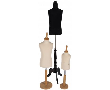 A.w. two with white fabric upholstery, resting on a stainless steel stem with wooden base, together with a black upholstered 