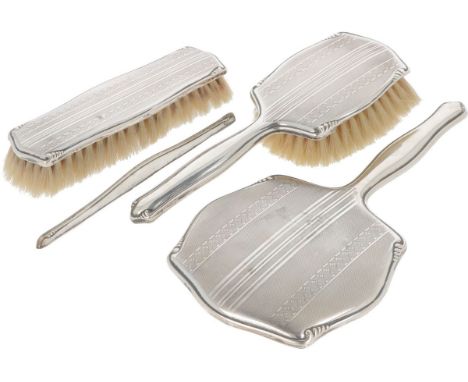 Consisting of a hand mirror, 2 brushes and a comb fixture, decorated with guilloche patterns. Germany, early 20th century, ha