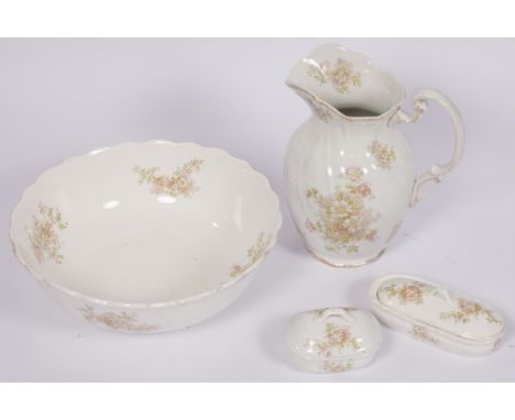 A pitcher and a matching bowl with polychromed transferware flowering motif. Estimate: € 20 - € 30.