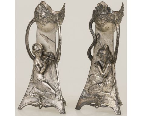 With three faces each and flowering motifs with stilized ornamental lines, the one a relief of a kneeling female figure with 