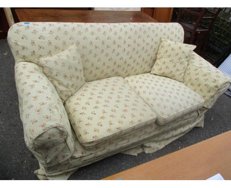 A Circa 1900's three-seater sofa with later upholstery standing on square tapering legs 