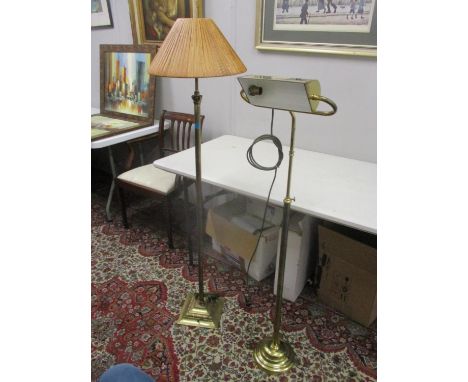 A brass standard lamp with a reeded column on a square base and a height adjustable brass reading lamp, both rewired and pat 