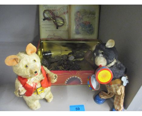 Two 1930s tin plate mechanical toys, together with a vintage tin containing a thimble, a watch and costume jewellery 