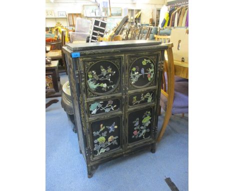 A modern Chinese gilt black lacquered, twin door cabinet with figural decorated doors, 34 1/2"h x 23 1/2"w 