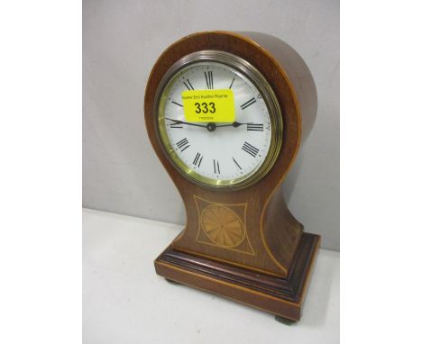 An Edwardian mahogany inlaid mantle clock with key 
